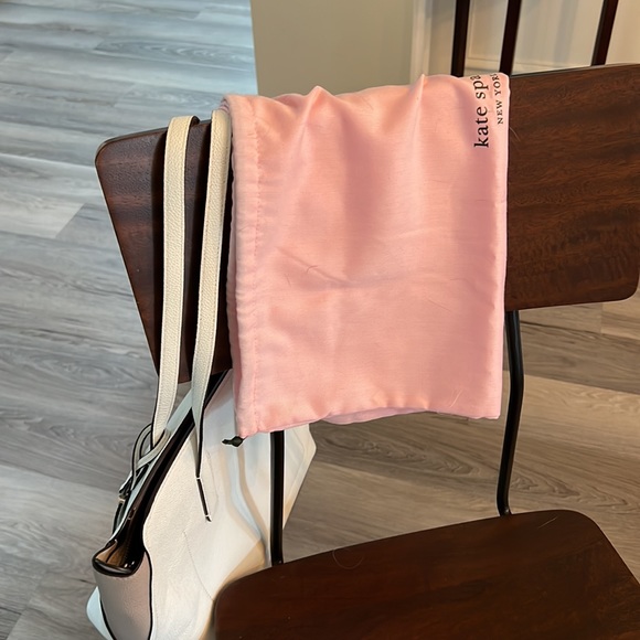 White,tote. Straps,bottom great condition. Front small wrinkle. - Picture 10 of 10